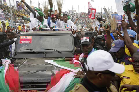 Bola Ahmed Tinubu (C) presidential candidate of the All Progressives Congress, waves to the crowd during an election campaign in Lagos, Nov. 26, 2022. (File Photo | AP)