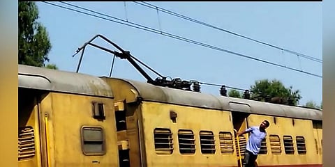 Passengers were stranded between KSR railway station and Bangarpet as the wires of the overhead electric equipment snapped in Kolar. (Photo | Special Arrangement)