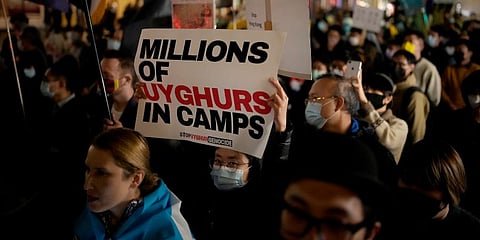Demonstrators supporting Tibetans, Uyghurs and Hong Kongers take part in a protest against the Chinese Communist Party in London, Nov 2022. (File Photo | AP)