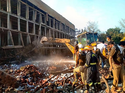 Rescue operation underway after a wall of a building collapsed at Daurala in Meerut, Friday, Feb. 24, 2023. (Photo | PTI)