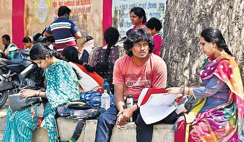 Candidates during their last-minute preparation for the TNPSC Group II exam at a centre in Presidency Girls High School in Chennai on Saturday | P Jawahar