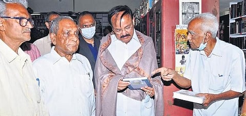 Former Vice-President of India M Venkaiah Naidu at Lanka Suryanarayana’s library consisting of over 1.3 lakh books | express