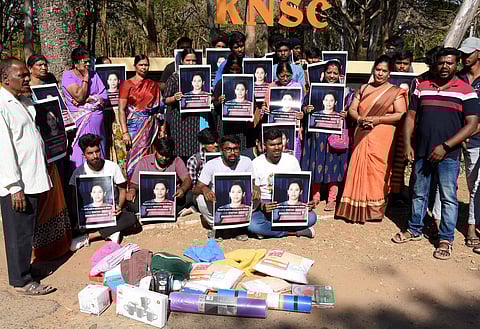 Fans of IAS officer Rohini Sindhuri stage a protest with the alleged missing items, in Mysuru. (Photo | Udayashankar S, EPS)