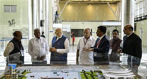 Prime Minister Narendra Modi with Union Minister Pralhad Joshi, Karnataka Chief Minister Basavaraj Bommai and former Karnataka chief minister B.S. Yediyurappa. (Photo | PTI)