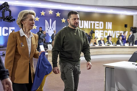 European Commission President Ursula von der Leyen with a Ukrainian flag and Ukrainian President Volodymyr Zelenskyy. (Photo | AP)