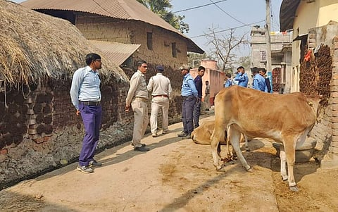 Police personnel outside the house of injured Laltu Sheikh in a bomb blast who was brought to state-run SSKM hospital in Kolkata, in Birbhum. (Photo | PTI)