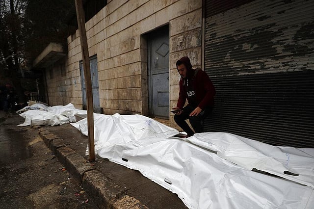 A man tries to identify the bodies of earthquake victims recovered outside a hospital, in Aleppo, Syria, Monday, Feb. 6, 2023. (Photo | AP)
