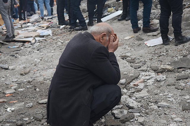 A man breaks down as people search for survivors through the rubble in Diyarbakir, on February 6, 2023. (Photo | AFP)