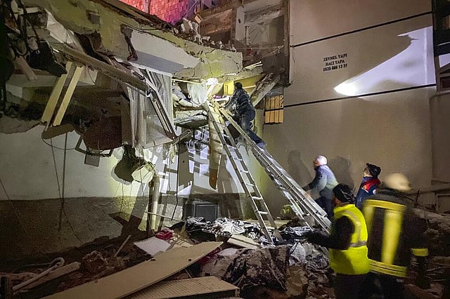 Rescue teams try to reach trapped residents inside collapsed buildings in Adana, Turkey, Monday, Feb. 6, 2023. A powerful quake has knocked down multiple buildings in southeast Turkey and Syria and many casualties are feared.(Photo | AP)