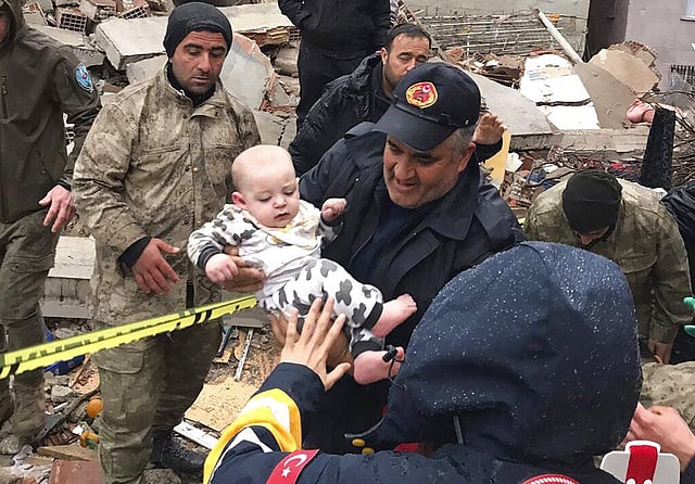 A baby is rescued from a destroyed building in Malatya, Turkey, Monday, Feb. 6, 2023. (Photo | AP)