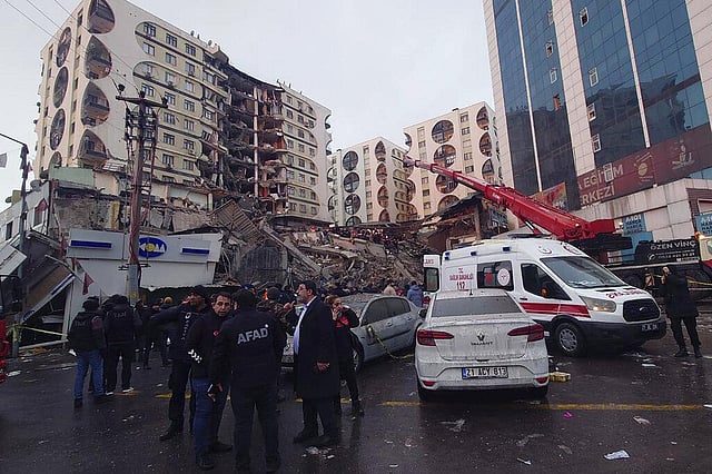 Rescue workers and medical teams try to reach trapped residents in a collapsed building following and earthquake in Diyarbakir, southeastern Turkey, early Monday, Feb. 6, 2023. (Photo | AP)