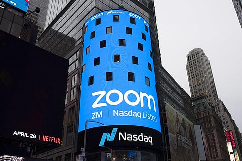 This file photo shows a sign for Zoom Video Communications ahead of the company's Nasdaq IPO in New York, April 18, 2019. (Photo | AP)