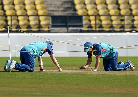 Australian skipper Pat Cummins and teammate David Warner examine the picth during a practice session at the VCA stadium in Nagpur. (Photo | PTI)