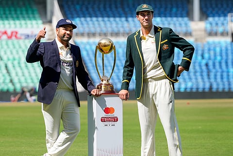 Indian captain Rohit Sharma and his Australian counterpart Pat Cummins pose with the trophy at the VCA Stadium in Nagpur, Feb. 8, 2023. (Photo | PTI)