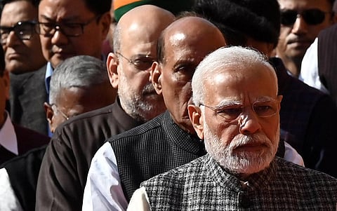PM Narendra Modi, Defence minister Rajnath Singh and Home minister Amit Shah stand in a queue to offer floral tributes to the victims of the 2001 terror attack on Parliament House.(File | EPS)