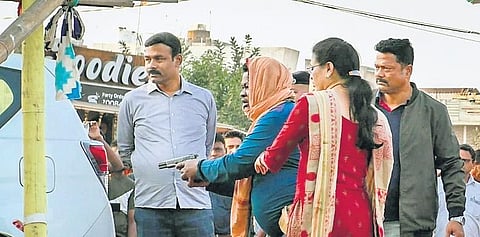 Accused ASI Gopal Das reenacting the shooting of minister Naba Das at Gandhi Chowk in Brajrajnagar on Tuesday afternoon | Express