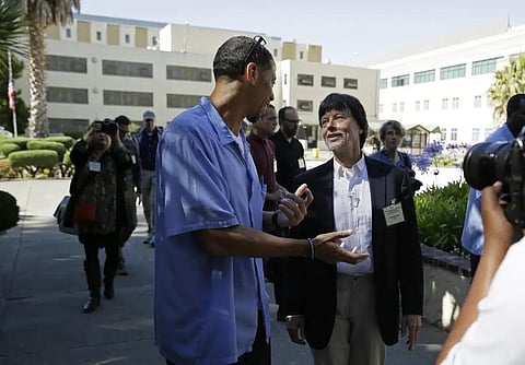 Filmmaker Ken Burns walks with inmate Rahsaan Thomas at San Quentin State Prison in San Quentin, Calif., on July 24, 2019.(File Photo | AP)