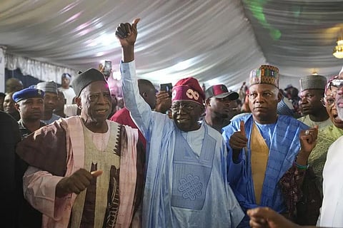 Bola Tinubu of the All Progressives Congress, center, celebrates with supporters at the party's campaign headquarters after winning the presidential elections in Nigeria, March 1, 2023. (Photo | AP)