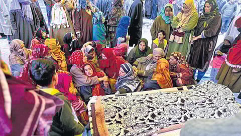 Villagers console the family of Sanjay Sharma who was shot dead on Sunday while on his way to a local market along with his wife | Zahoor Punjabi