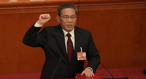 Newly elected Chinese Premier Li Qiang takes his oath during a session of China's National People's Congress (NPC) at the Great Hall of the People in Beijing, Saturday, March 11.(Photo | AP)
