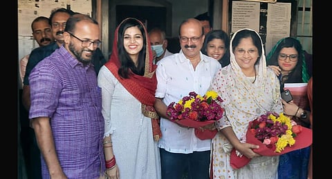 ​Advocate C Shukkur and Dr Sheena Shukkur with their daughters, friends, and relatives at Hosdurg sub-registrar office in Kasaragod on Wednesday. (Photo | Express)
