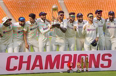 Indian players pose with Border-Gavaskar Trophy 2023 after winning the 4-match series by 2-1 with a draw in the last test cricket match against Australia, on March 13, 2023. (Photo | PTI)