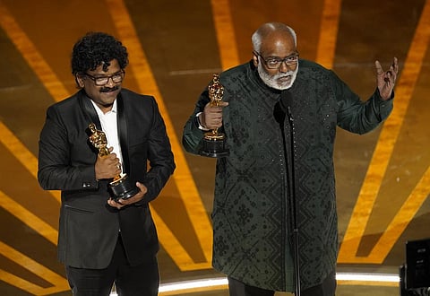 M.M. Keeravaani, right, and Chandrabose accept the award for best original song for 'Naatu Naatu' from 'RRR' at the Oscars. (Photo | AP)