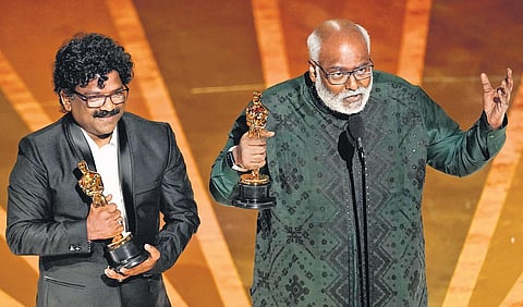 M M Keeravaani (right) and Chandrabose accept the award for Best Original Song for Naatu Naatu from RRR at the Oscars ceremony in Los Angeles on Sunday | AP