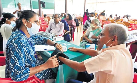 A doctor checking an elderly patient at the health camp organised in the wake of the fire at Brahmapuram waste treatment plant