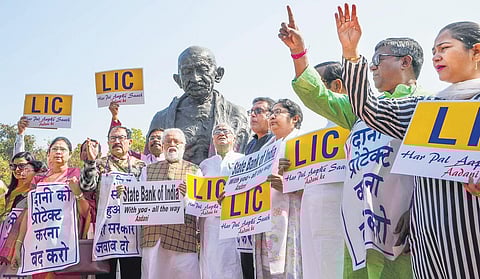 Trinamool Congress MPs holding their separate protest at the Parliament House complex over the Adani row during the Budget session, in New Delhi on Tuesday. (Photo | PTI)