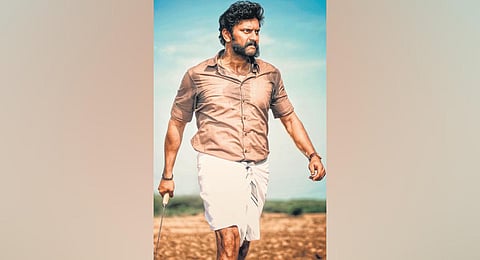 Poster from Kazhuvethi Moorkan. (File Photo)