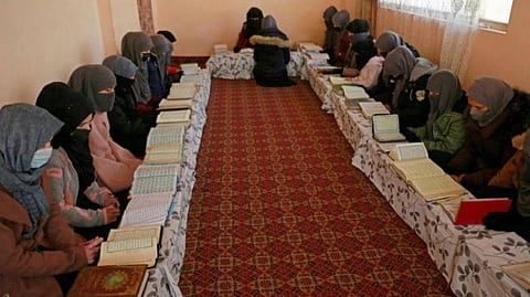 Afghan girls learn the holy Koran at a madrassa or an Islamic school on the outskirts of Kabul. 