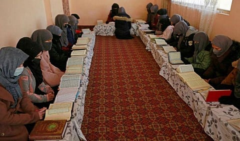 Afghan girls learn the holy Koran at a madrassa or an Islamic school on the outskirts of Kabul. (Photo | AFP)