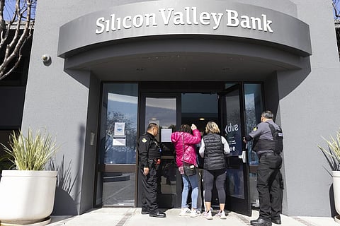 Security guards let individuals enter the Silicon Valley Bank's headquarters in Santa Clara on Monday, March 13, 2023 (Photo | AP)
