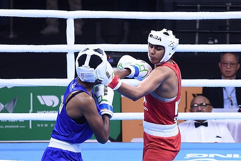 Shashi Chopra in action against Kenya's Mwangi Teresiah  in New Delhi on Friday. Shashi won by 5-0 verdict to advance. (Photo | Parveen Negi)
