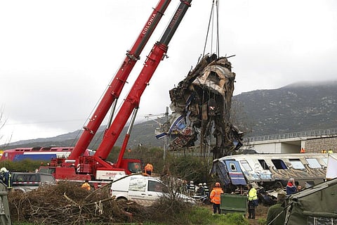Cranes remove debris after a trains' collision in Tempe, about 376 kilometres (235 miles) north of Athens, near Larissa city, Greece on Thursday, March 2, 2023. (Photo | AP)