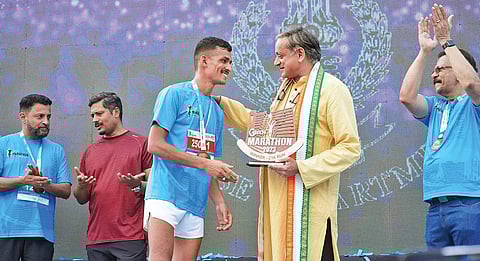 MP Shashi Tharoor congratulating the winner of GTech marathon held in Thiruvananthapuram on Sunday