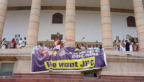 Opposition MPs protest, on the first floor of the Parliament in New Delhi, demanding a joint parliamentary committee (JPC) probe into the Adani Group, March 21, 2023. (Photo | PTI)