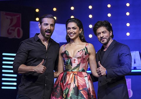 Actors John Abraham, Deepika Padukone and Shah Rukh Khan during a press conference for 'Pathaan'. (Photo | PTI)