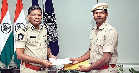 DGP giving an appreciation certificate to constable Angani Chinna Veerababu I express