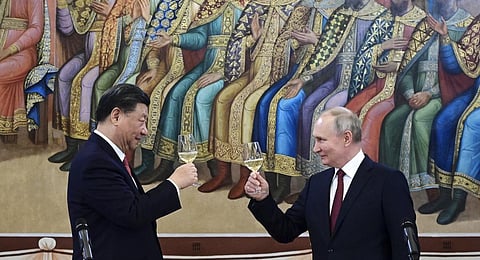 Russian President Vladimir Putin, right, and Chinese President Xi Jinping toast during their dinner at The Palace of the Facets, a building in the Moscow Kremlin, Russia.(Photo | AP)