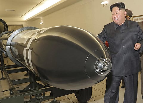 North Korean leader Kim Jong Un visits a hall displaying various types of warheads designed to be mounted on missiles/rocket launchers on March 27, 2023, in undisclosed location. (Photo | AP)