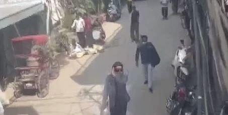 Amritpal Singh seen without a turban and wearing a mask. (Screengrab)