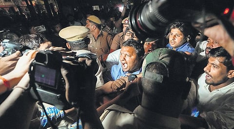 Youth Congress national president Srinivas BV (centre) in a scuffle with police during a protest march, near Red Fort in New Delhi on Tuesday. (Photo | PTI)