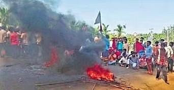 Members of the Banjara community block Shivamogga-Shikaripura highway near Kunchenahalli on Tuesday | Express
