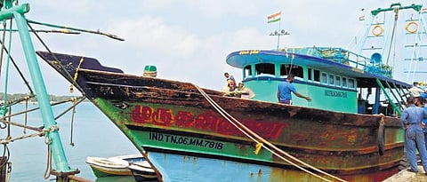 A mechanised boat from Nagapattinam district, which was impounded mid-sea, anchored in a harbour in Sri Lanka | Express
