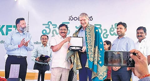 Agriculture Minister S Niranjan Reddy felicitates Syngenta CEO J Erik Frywald in Wanaparthy on Thursday