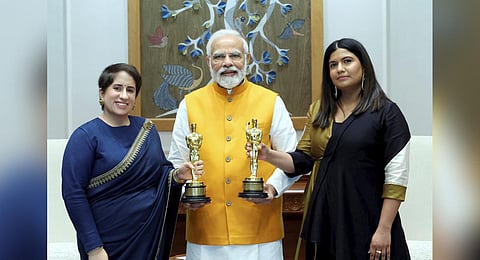 Prime Minister Narendra Modi with Oscar 2023 winning documentary short film 'The Elephant Whisperers' producer Guneet Monga and director Kartiki Gonsalves, in New Delhi. (Photo | PTI)