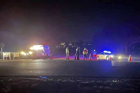 Emergency responders seen near a site where two military helicopters crashed during a routine training mission in Trigg County, in southwestern Kentucky, on the night of March 29, 2023. (Photo | AP)