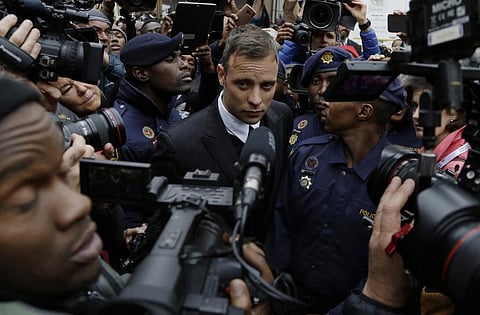 Oscar Pistorius leaves the High Court in Pretoria, South Africa, Tuesday June 14, 2016 during his trail for the murder of girlfriend Reeva Steenkamp. (Photo | AP)